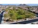 An aerial shot shows the green community park and play area, great for families at 7609 W Whitehorn Trl, Peoria, AZ 85383