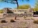 Rock Springs community entrance sign featuring stone architecture and desert landscaping under a clear blue sky at 7609 W Whitehorn Trl, Peoria, AZ 85383