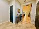 Inviting entryway featuring tile floors, a decorative table, and views into the living spaces at 7609 W Whitehorn Trl, Peoria, AZ 85383