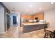 Well-lit kitchen featuring stainless appliances, countertop, cabinets and tile floors at 7609 W Whitehorn Trl, Peoria, AZ 85383