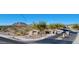 Street view featuring the 'Rock Springs' community entrance sign, desert landscaping, and mountain views in the background at 7609 W Whitehorn Trl, Peoria, AZ 85383