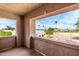 Balcony with views of the neighborhood and palm trees at 7830 E Park View Dr, Mesa, AZ 85208