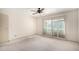 A bright bedroom featuring a ceiling fan and sliding glass doors at 7830 E Park View Dr, Mesa, AZ 85208