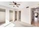 Neutral bedroom featuring a ceiling fan and closet space at 7830 E Park View Dr, Mesa, AZ 85208