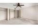 Neutral bedroom featuring a ceiling fan and closet space at 7830 E Park View Dr, Mesa, AZ 85208