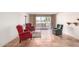 Living room with tile flooring, red and green arm chairs, with a view to the patio at 7830 E Park View Dr, Mesa, AZ 85208