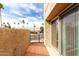 Patio with desert landscape beyond the gate at 7830 E Park View Dr, Mesa, AZ 85208