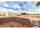 Tiled patio with views of green space and blue sky at 7830 E Park View Dr, Mesa, AZ 85208