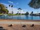 This is a large pond in the Fountain of the Sun community with lush landscaping and walking path at 7830 E Park View Dr, Mesa, AZ 85208