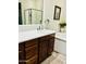 Bathroom featuring a vanity with stone countertop, bathtub, and walk-in shower at 804 W Village Pkwy, Litchfield Park, AZ 85340