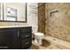 Bathroom featuring tile floors, a vanity with a granite countertop, toilet, and a walk-in shower with tile surround at 8434 E Natal Cir, Mesa, AZ 85209