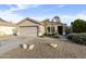 Charming single-story home with a well-maintained yard and attached two-car garage at 8434 E Natal Cir, Mesa, AZ 85209