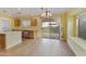 Bright and airy kitchen with wood floors, stainless steel appliances, and a sliding glass door at 8434 E Natal Cir, Mesa, AZ 85209