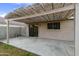 This backyard patio features a pergola cover and access to an outdoor living space, perfect for relaxation at 8434 E Natal Cir, Mesa, AZ 85209