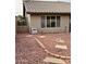 Cozy backyard with red rock landscaping, creating a unique and low-maintenance outdoor space at 8536 W Rockwood Dr, Peoria, AZ 85382