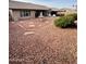 Spacious backyard with a fountain, patio seating, and a hot tub, perfect for outdoor relaxation and entertainment at 8536 W Rockwood Dr, Peoria, AZ 85382