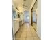 Hallway view of bathroom featuring double vanity sinks and closets at 8536 W Rockwood Dr, Peoria, AZ 85382