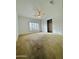 Bright bedroom featuring carpet, ceiling fan, and a window with shutters overlooking the front yard at 8536 W Rockwood Dr, Peoria, AZ 85382