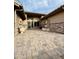 Welcoming front entrance with a decorative water fountain and a spacious brick-paved courtyard leading to the front door at 8536 W Rockwood Dr, Peoria, AZ 85382