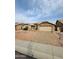 Attractive single-level home with a spacious driveway, decorative rock landscaping, and a two-car garage with stone accents at 8536 W Rockwood Dr, Peoria, AZ 85382