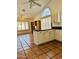 Bright kitchen with white cabinets, black countertops, and open layout to adjacent living area at 8536 W Rockwood Dr, Peoria, AZ 85382