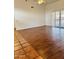 Spacious living room featuring wood flooring and sliding glass doors for natural light at 8536 W Rockwood Dr, Peoria, AZ 85382