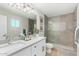 Modern bathroom featuring a double vanity, walk-in shower, and stylish fixtures at 8602 E Mitchell Dr, Scottsdale, AZ 85251