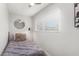 Bright bedroom with neutral walls, ceiling fan, a large window, and modern decor at 8602 E Mitchell Dr, Scottsdale, AZ 85251