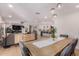 Open-concept dining space with elegant decor and seamless flow into the living area and kitchen at 8602 E Mitchell Dr, Scottsdale, AZ 85251