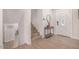 Inviting home foyer with staircase, stylish console table, and decorative mirror accentuating the space at 8602 E Mitchell Dr, Scottsdale, AZ 85251