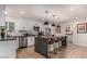 Modern kitchen with island seating, sleek countertops, stainless steel appliances, and bright lighting at 8602 E Mitchell Dr, Scottsdale, AZ 85251