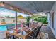 Outdoor dining area with a ceiling fan and views of the pool at 8602 E Mitchell Dr, Scottsdale, AZ 85251