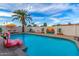 Inviting swimming pool with a pink flamingo float and Scottsdale mural at 8602 E Mitchell Dr, Scottsdale, AZ 85251