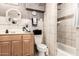 Bathroom features a tiled shower, single sink vanity, and natural-colored walls at 8621 W Via Montoya Dr, Peoria, AZ 85383