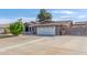 Large driveway leading to a well-kept home with a two-car garage at 8621 W Via Montoya Dr, Peoria, AZ 85383