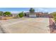 Spacious driveway leading to a single-story home with a tandem two-car garage at 8621 W Via Montoya Dr, Peoria, AZ 85383