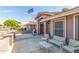 Comfortable front porch featuring seating and a beautifully landscaped entrance at 8621 W Via Montoya Dr, Peoria, AZ 85383