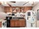 Kitchen featuring wooden cabinets, a black countertop, and stainless steel appliances at 8621 W Via Montoya Dr, Peoria, AZ 85383