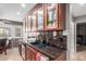 Kitchen area with stainless steel appliances, granite counters, and custom cabinets at 8621 W Via Montoya Dr, Peoria, AZ 85383