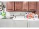 Efficient laundry room with side-by-side washer and dryer, complemented by overhead cabinetry for storage at 8621 W Via Montoya Dr, Peoria, AZ 85383