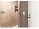 Step into luxury with this bathroom shower featuring tile surround and a convenient niche for toiletries at 8621 W Via Montoya Dr, Peoria, AZ 85383