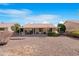 House has a large backyard and covered patio perfect for entertaining at 9214 E Diamond Dr, Sun Lakes, AZ 85248