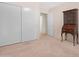 Bedroom featuring an antique wooden hutch and a sliding door closet at 9214 E Diamond Dr, Sun Lakes, AZ 85248