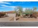 Inviting single-story home with desert landscaping, tile roof, and mailbox at the curb at 9214 E Diamond Dr, Sun Lakes, AZ 85248