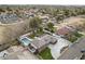 Aerial view of the property showcasing pool, yard, and landscaping in a residential neighborhood at 9505 S Kenneth Pl, Tempe, AZ 85284