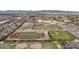 Aerial view of school including sports fields, baseball diamonds, and parking lots at 9505 S Kenneth Pl, Tempe, AZ 85284