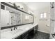 Bathroom features a black and white color scheme with a long vanity and an oversized mirror at 9505 S Kenneth Pl, Tempe, AZ 85284