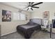 Nicely designed bedroom featuring a modern bed, a comfortable gaming chair, and natural light at 9505 S Kenneth Pl, Tempe, AZ 85284