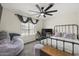 Comfortable bedroom featuring a modern ceiling fan, a window, and a spacious layout at 9505 S Kenneth Pl, Tempe, AZ 85284