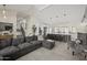 Open concept living room seamlessly connects with the modern kitchen and features a staircase leading to the upper level at 9505 S Kenneth Pl, Tempe, AZ 85284